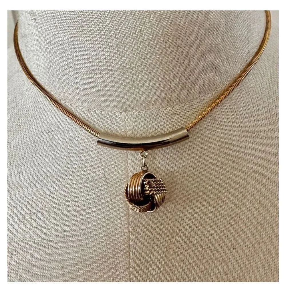 Gold tone vintage knot pendant necklace